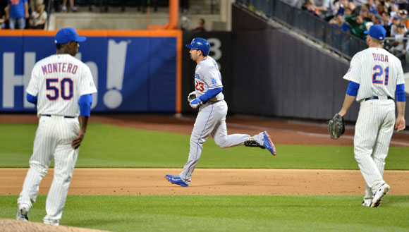 Adrian Gonzalez rounds the bases after homering in the fifth inning.