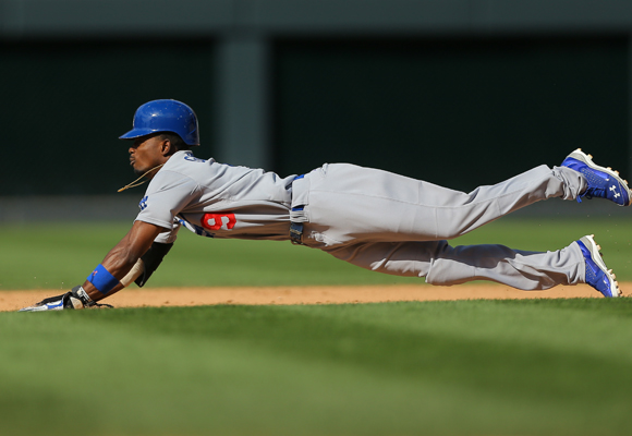 Dodgers baserunner Dee Gordon steals second base during the eighth inning of the team's 8-7 loss to the Colorado Rockies.