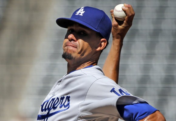 Dodgers starter Carlos Frias delivers a pitch during the first inning of a 16-2 loss to the Colorado Rockies.
