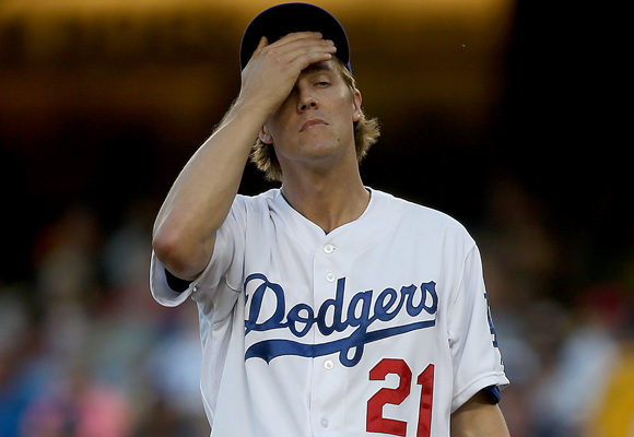 Dodgers starter Zack Greinke reacts after giving up four runs in the first inning of the team's 5-0 loss to the Angels.
