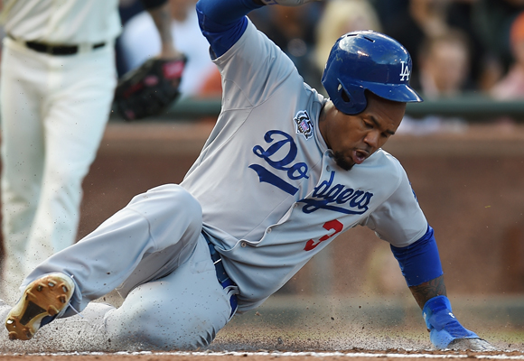 Dodgers outfielder Carl Crawford scores during the fourth inning of the team's 4-3 win over the San Francisco Giants.
