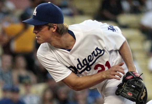 Dodgers starter Zack Greinke delivers a pitch during the team's 6-3 loss to the Milwaukee Brewers.