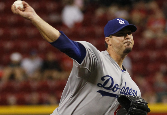 Dodgers starter Josh Beckett delivers a pitch during the first inning of the team's 6-1 win over the Cincinnati Reds.