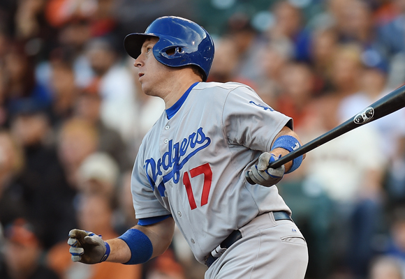 Dodgers catcher A.J. Ellis hits a run-scoring single in the first inning of a 17-0 win over the San Francisco Giants.