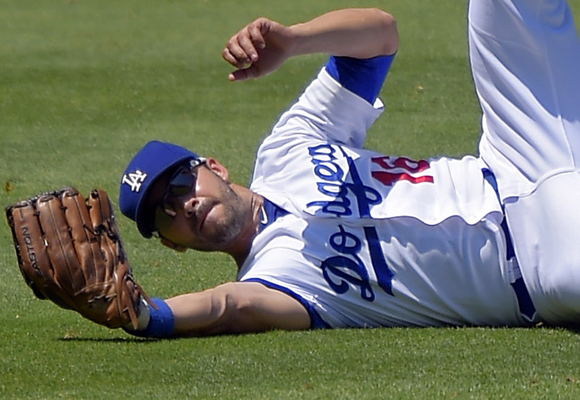 Dodgers left fielder Andre Ethier makes a diving catch during the third inning of the team's 11-3 loss.