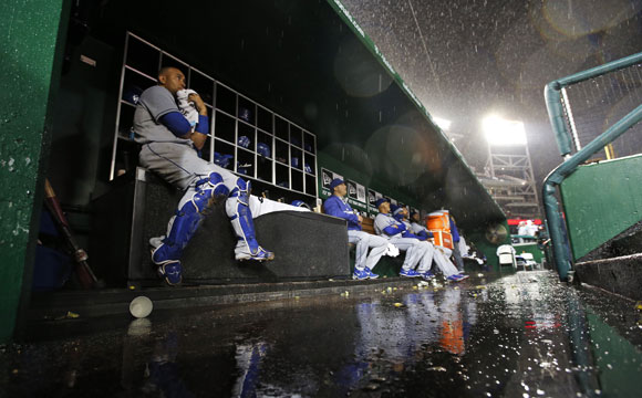 Water builds up in the Dodgers dugout during a lengthy rain delay.