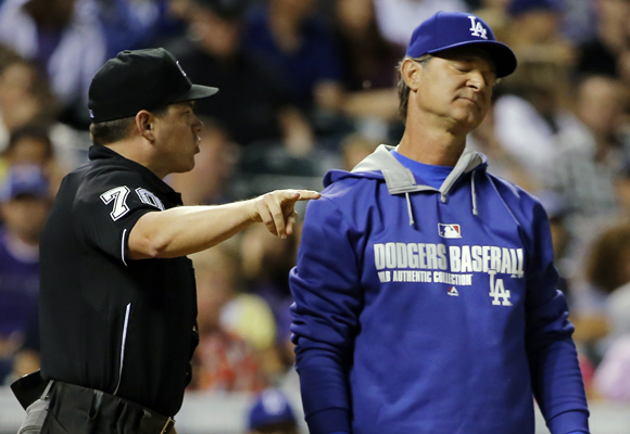 Dodgers Manager Don Mattingly, right, reacts during an argument with home plate umpire D.J. Reyburn in the sixth inning of a 10-4 loss to the Colorado Rockies.