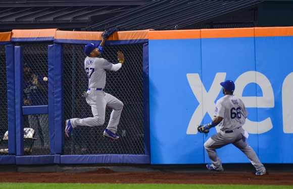 Matt Kemp makes a valiant effort but just misses this run-scoring double by Curtis Granderson in the eighth inning.