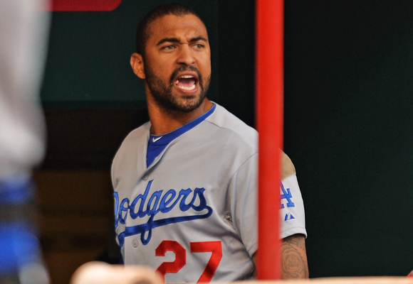 Dodgers outfielder Matt Kemp continues to shout at home plate umpire Seth Buckminster after being ejected in the second inning of the team's 5-0 loss to the Cincinnati Reds.