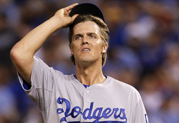 Dodgers starter Zack Greinke reacts after giving up a run-scoring triple in the sixth inning of the team's 5-3 loss to the Kansas City Royals.