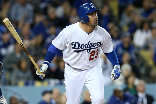 Dodgers first baseman Adrian Gonzalez hits a solo home run during the fifth inning of a 7-4 win over the Padres.