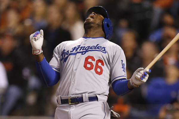 Dodgers right fielder Yasiel Puig reacts after popping up the ball during a loss to the Giants.