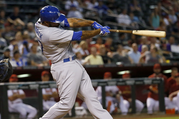 Dodgers second baseman Howie Kendrick follows through on a solo home run during the 10th inning of a 6-4 victory over the Arizona Diamondbacks.