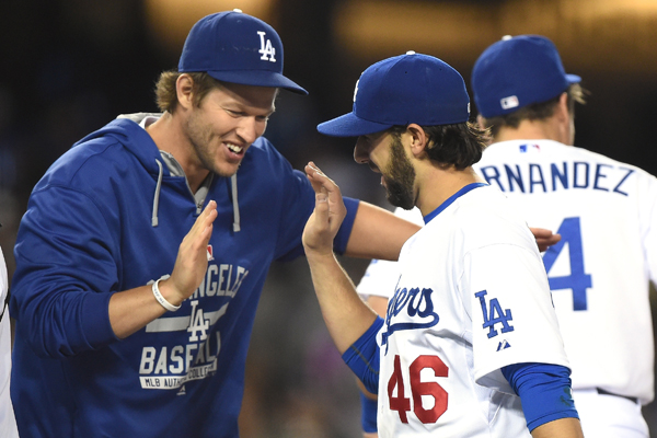 Dodgers pitcher Mike Bolsinger, right, is congratulated by pitcher Clayton Kershaw after the team's 2-0 win over the San Diego Padres.