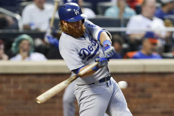 Dodgers' Justin Turner hits a double during the fourth inning of a 7-2 win over the New York Mets.