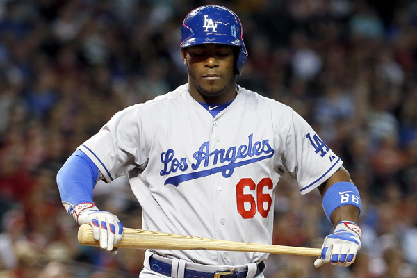 Dodgers right fielder Yasiel Puig reacts after striking out during the fifth inning of a 4-3 loss to the Diamondbacks.