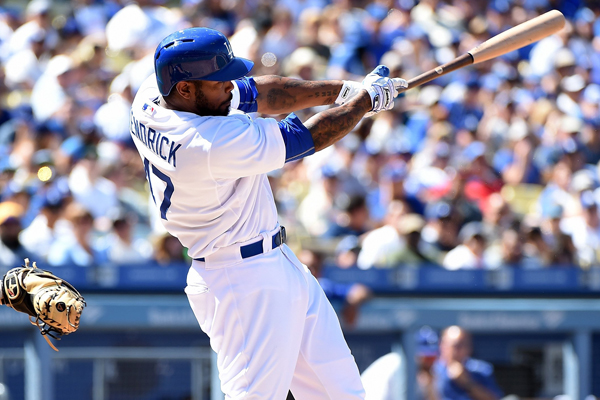 Dodgers second baseman Howie Kendrick hits a solo home run in the sixth inning of a 7-0 victory over the Rockies.