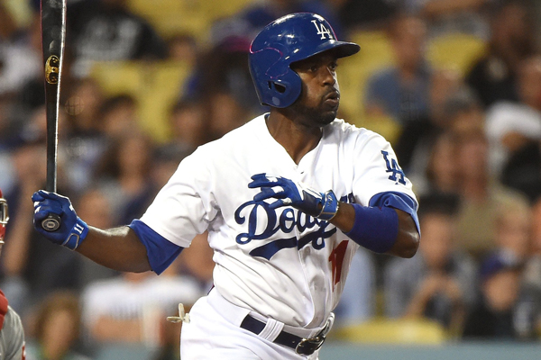 Dodgers shortstop Jimmy Rollins hits a single during the sixth inning of a 10-7 victory over the Philadelphia Phillies.