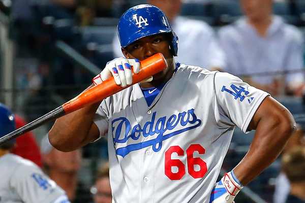 Dodgers right fielder Yasiel Puig reacts after taking a strike during the eighth inning of a 4-3 loss to the Atlanta Braves.