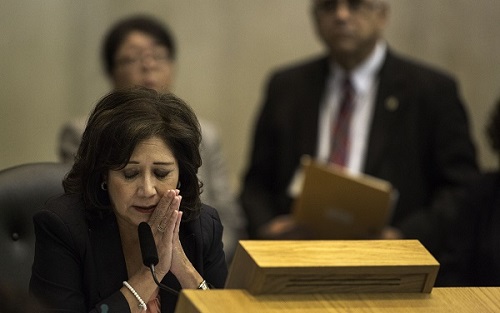Los Angeles County Supervisor Hilda Solis listens during public comments on toxic contamination by Exide Technologies during meeting at the Hahn Hall of Administration in Los Angeles, Calif.
