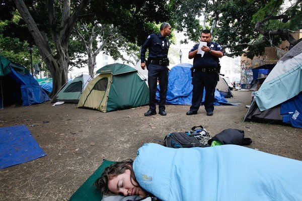 Los Angeles police officers count tents at City Hall. (Nov. 28, 2011)