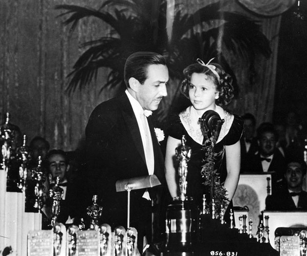 Shirley Temple, 9, presents Walt Disney with a special Oscar.