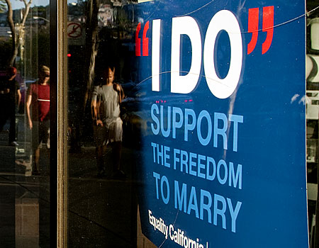 A poster supporting the freedom to marry hangs in the front window of a hardware store on Santa Monica Boulevard the evening before the Supreme Court decision on Prop. 8 in West Hollywood, Calif.