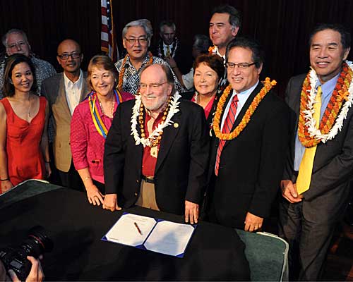 Gov. Neil Abercrombie, center, poses with legislators and supporters after he signed the bill legalizing gay marriage. 
