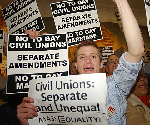 David Vaughan, who supports same-sex marriage, is surrounded by opponents in Boston.