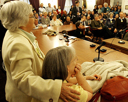 Sandi Cote-Whitacre, left, and her partner of 42 years, Bobbi Cote-Whitacre, take part in a rally after the passage of the same-sex marriage bill.