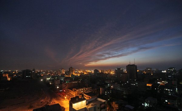A panoramic view of Gaza City at dusk.