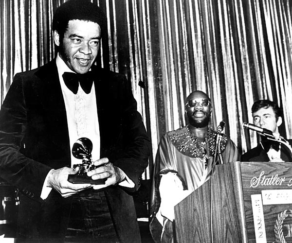Singer-songwriter Bill Withers with his award for rhythm & blues song for his hit, "Ain't No Sunshine," at the 1972 Grammy Awards in New York City.