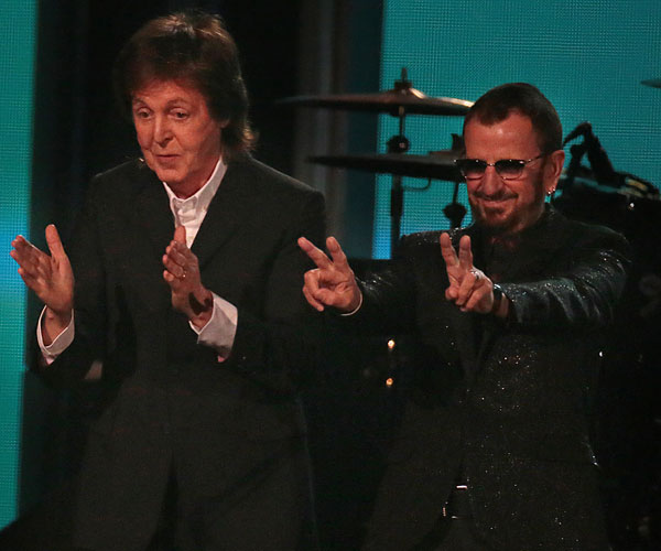 Paul McCartney and Ringo Starr take a bow after their performance of "Queenie Eye," in a reunion of the surviving members of the Beatles.